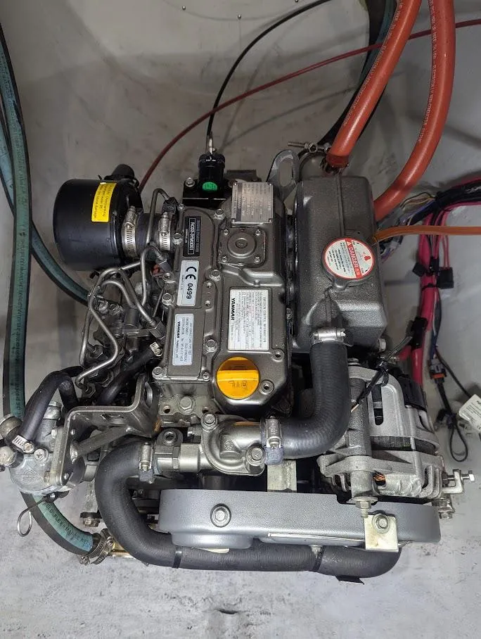 Slide: The Image of Engine of a 2020 Seawind 1260 catamaran, showcasing mechanical components and wiring. - 34