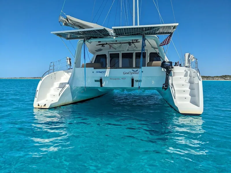 Slide: The Image of 2020 Seawind 1260 catamaran on clear turquoise water, rear view. - 4