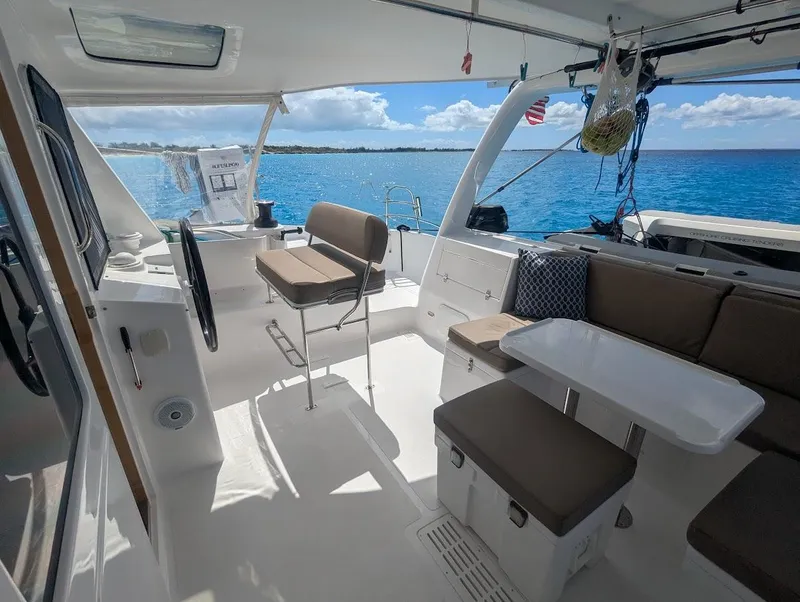 Slide: The Image of Interior of 2020 Seawind 1260 catamaran with seating, table, and ocean view. - 9