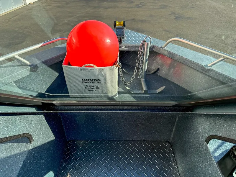 Slide: The Image of Pro-Steelheader 18 Sea Predator OS 2011 boat with anchor, red buoy, and engine oil. - 10