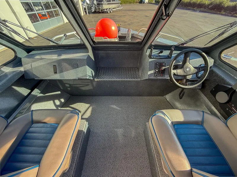 Slide: The Image of Interior of 2011 Pro-Steelheader 18 Sea Predator OS boat with steering wheel and seats. - 11