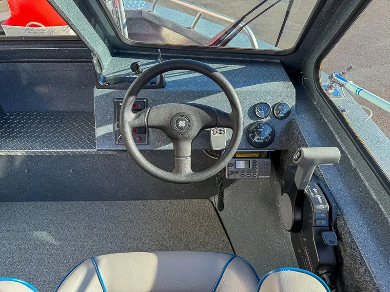 Slide: The Image of Interior view of 2011 Pro-Steelheader 18 Sea Predator OS boat cockpit with steering wheel and controls. - 12