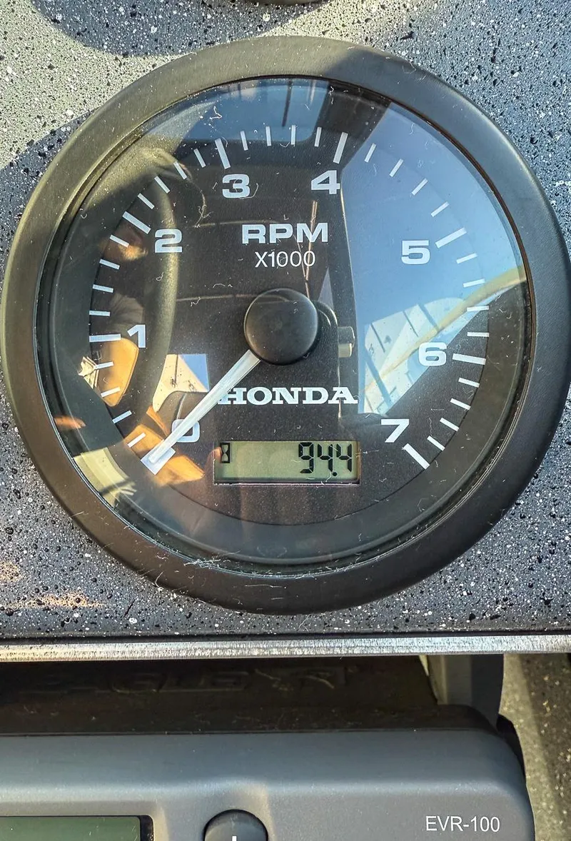 Slide: The Image of Close-up of a Honda RPM gauge on a 2011 Pro-Steelheader 18 Sea Predator OS. - 13