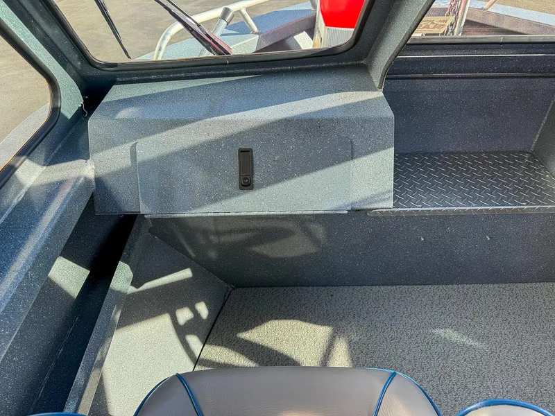 Slide: The Image of Interior of 2011 Pro-Steelheader 18 Sea Predator OS boat, featuring seating and dashboard. - 14