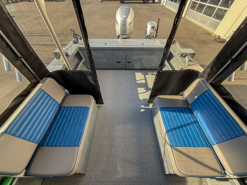 Slide: The Image of Interior view of 2011 Pro-Steelheader 18 Sea Predator OS boat with blue seating. - 17