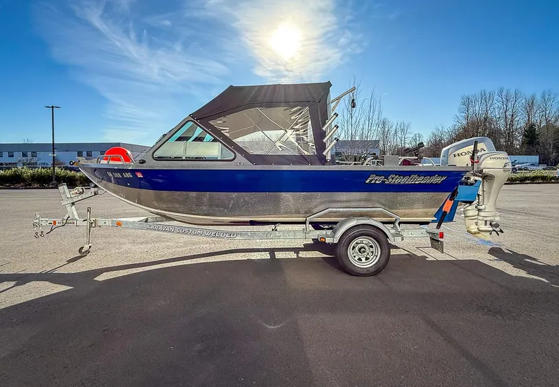 Slide: The Image of 2011 Pro-Steelheader 18 Sea Predator OS boat on trailer, sunny day background. - 6
