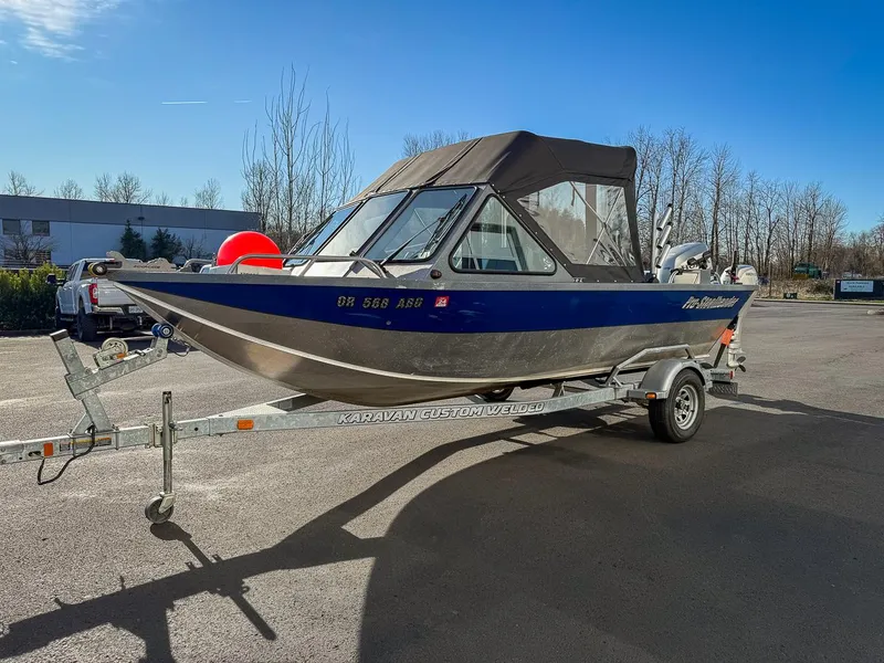 Slide: The Image of 2011 Pro-Steelheader 18 Sea Predator OS boat on trailer, parked outdoors. - 7