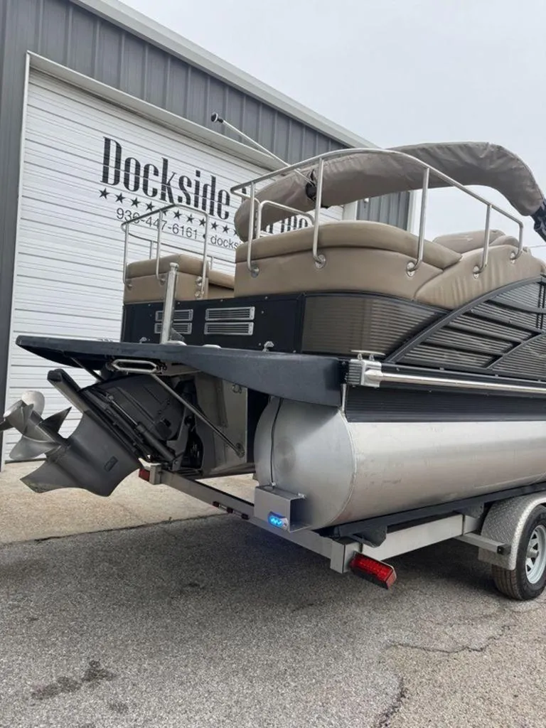Slide: The Image of 2016 Bennington 2575 QCW I/O pontoon boat on trailer at Dockside facility. - 17
