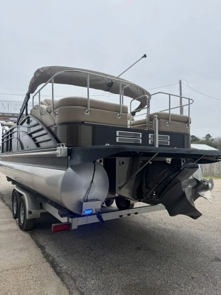 Slide: The Image of 2016 Bennington 2575 QCW I/O pontoon boat on trailer, rear view. - 18