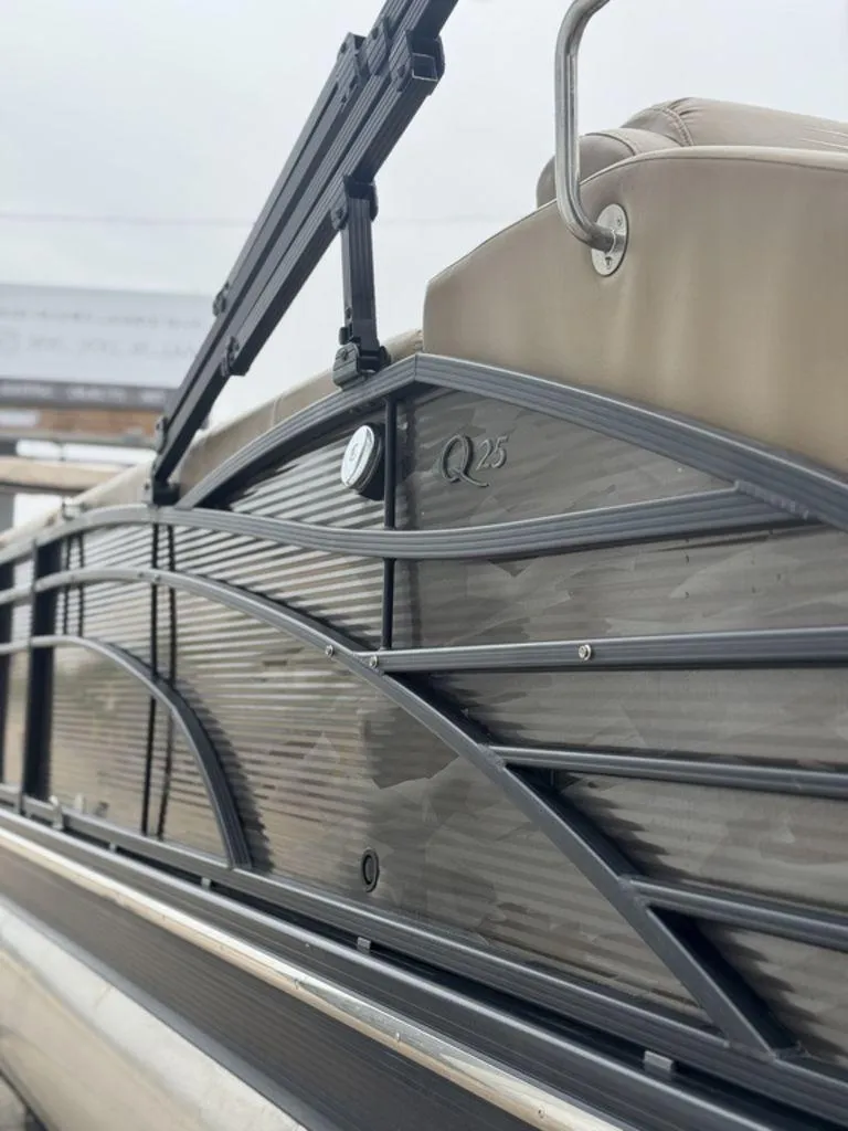 Slide: The Image of 2016 Bennington 2575 QCW I/O boat side view with sleek design details. - 19