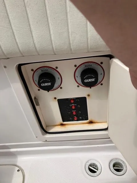 Slide: The Image of Control panel of a 2003 Grady-White Sailfish 282 boat, featuring battery switches. - 14