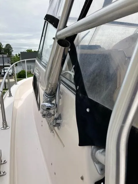 Slide: The Image of 2003 Grady-White Sailfish 282 boat with stainless steel railing and clear enclosure. - 5