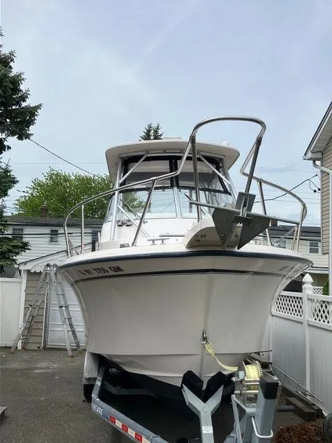 Slide: The Image of 2003 Grady-White Sailfish 282 boat on trailer, parked in residential driveway. - 6