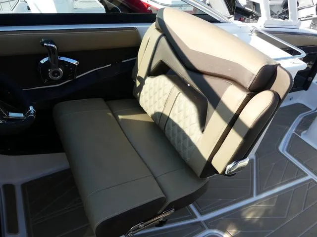 Slide: The Image of 2025 Monterey 255SS boat seat with beige upholstery and modern design. - 11
