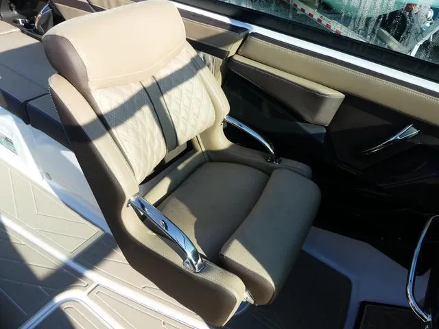 Slide: The Image of Luxurious seating in 2025 Monterey 255SS boat with beige upholstery and chrome accents. - 12