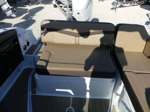 Slide: The Image of 2025 Monterey 255SS boat seating area with beige cushions and modern design. - 16