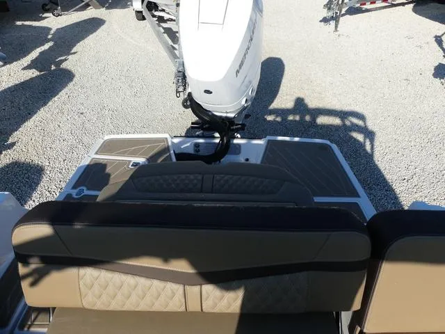 Slide: The Image of 2025 Monterey 255SS boat with outboard motor and cushioned seating. - 17