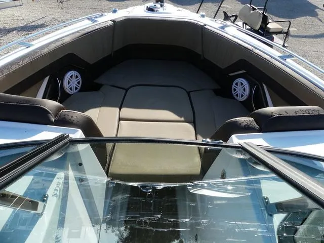 Slide: The Image of 2025 Monterey 255SS boat interior with cushioned seating and speakers. - 18