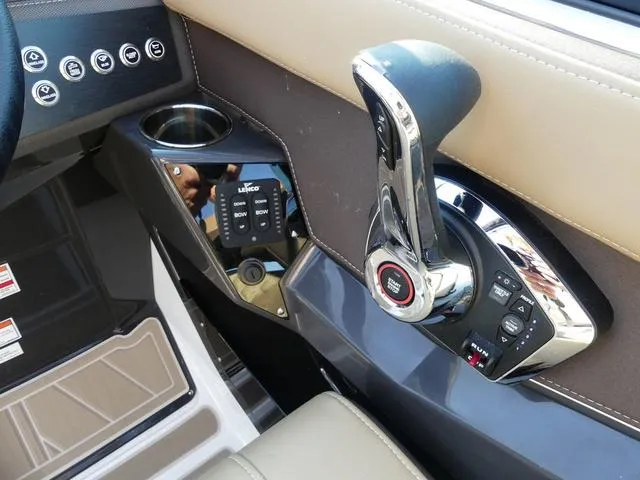 Slide: The Image of Interior of 2025 Monterey 255SS boat featuring modern control panel and throttle. - 22