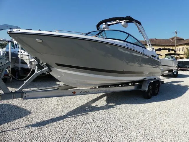 Slide: The Image of 2025 Monterey 255SS boat on trailer, sleek design, parked outdoors. - 3