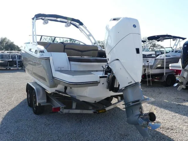 Slide: The Image of 2025 Monterey 255SS boat on trailer, featuring sleek design and powerful outboard motor. - 5