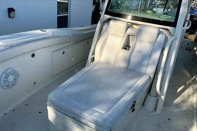 Slide: The Image of 2016 Hydra-Sports 3400 CC boat interior with cushioned seating and storage compartments. - 14