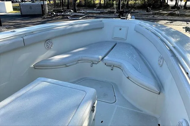 Slide: The Image of 2016 Hydra-Sports 3400 CC boat interior with cushioned seating and storage. - 15