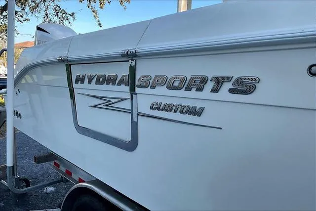 Slide: The Image of 2016 Hydra-Sports 3400 CC boat side view with custom branding. - 17