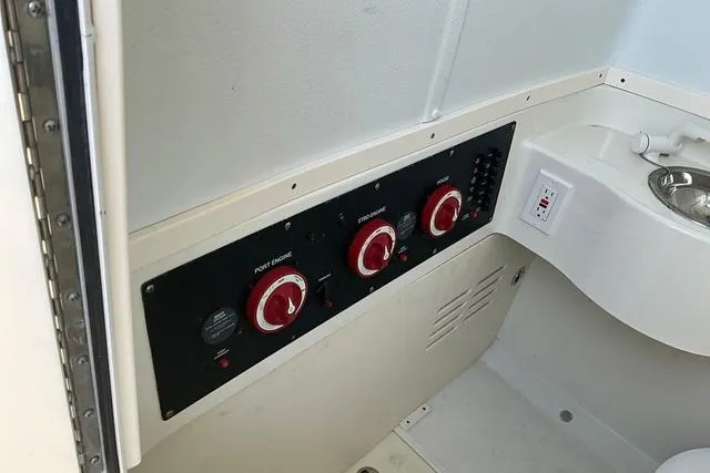 Slide: The Image of Control panel and sink area on a 2016 Hydra-Sports 3400 CC boat. - 19