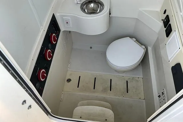 Slide: The Image of 2016 Hydra-Sports 3400 CC boat interior with toilet and sink. - 20