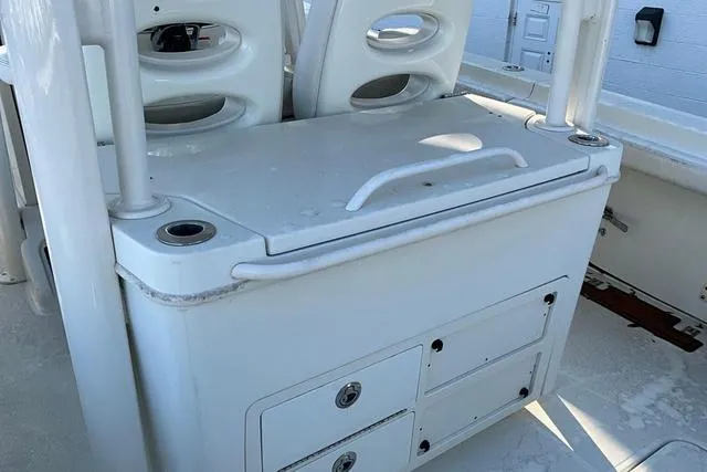 Slide: The Image of 2016 Hydra-Sports 3400 CC boat interior with storage compartments and seating. - 22