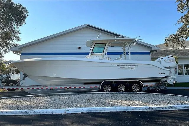 Slide: The Image of 2016 Hydra-Sports 3400 CC boat on trailer, parked near a building. - 3