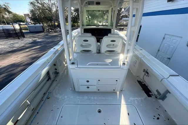 Slide: The Image of 2016 Hydra-Sports 3400 CC boat interior with seating and storage compartments. - 4