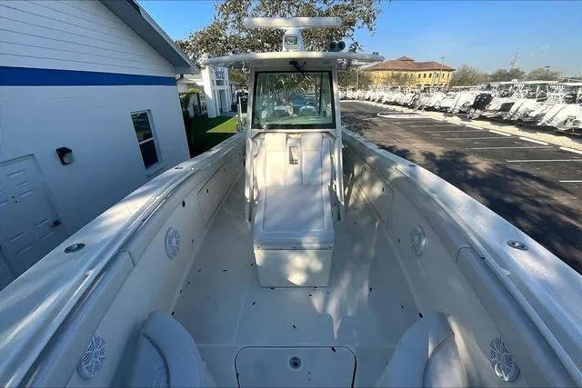 Slide: The Image of 2016 Hydra-Sports 3400 CC boat, spacious deck, white interior, parked outdoors. - 5
