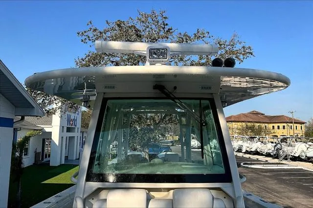 Slide: The Image of 2016 Hydra-Sports 3400 CC boat front view with radar and spotlight, parked outdoors. - 6