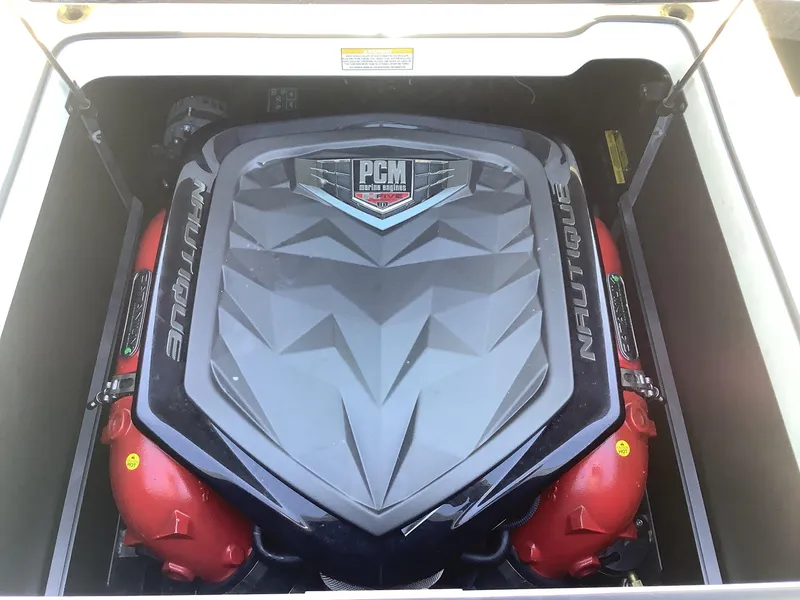 Slide: The Image of 2019 Nautique GS24 engine compartment with PCM marine engine. - 21