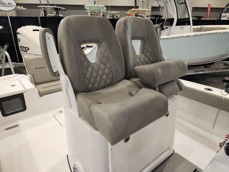 Slide: The Image of 2025 Sportsman Masters 267OE Bay Boat with luxurious gray seating and modern design. - 13