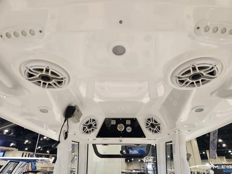 Slide: The Image of 2025 Sportsman Masters 267OE Bay Boat interior with speakers and control panel. - 17