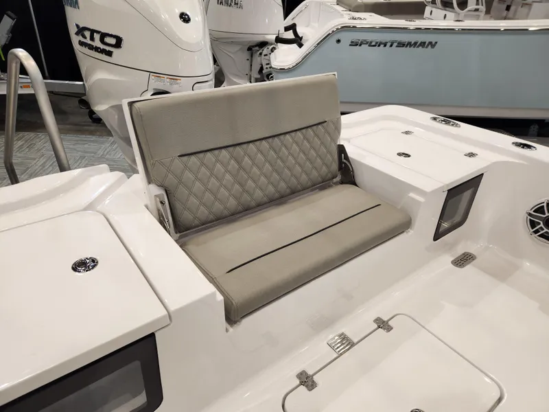 Slide: The Image of 2025 Sportsman Masters 267OE Bay Boat with cushioned seating and Yamaha XTO outboard motor. - 18