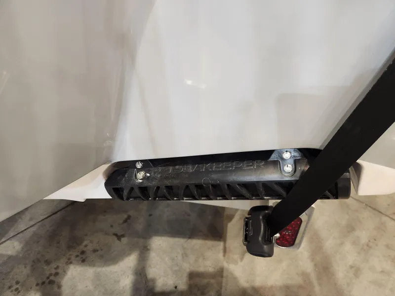 Slide: The Image of 2025 Sportsman Masters 267OE Bay Boat with trailer strap and keel protector. - 20