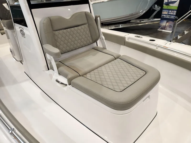 Slide: The Image of 2025 Sportsman Masters 267OE Bay Boat with cushioned seating and sleek design. - 6