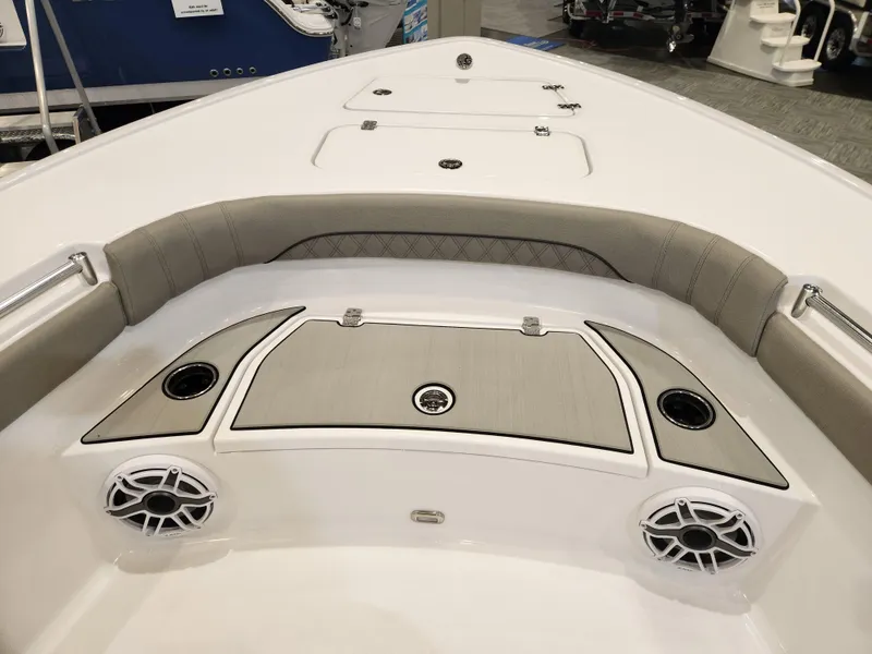 Slide: The Image of 2025 Sportsman Masters 267OE Bay Boat interior with cushioned seating and built-in speakers. - 8