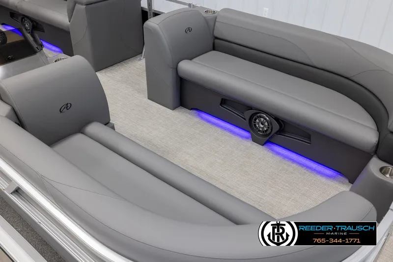 Slide: The Image of Luxurious Avalon VLS QL 2025 boat interior with gray seating and ambient blue lighting. - 10