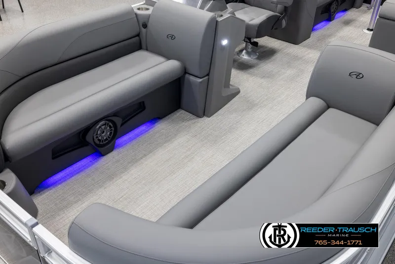 Slide: The Image of Luxurious 2025 Avalon VLS QL boat interior with gray seating and ambient blue lighting. - 11