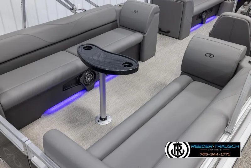 Slide: The Image of 2025 Avalon VLS QL boat interior with gray seating and ambient blue lighting. - 13