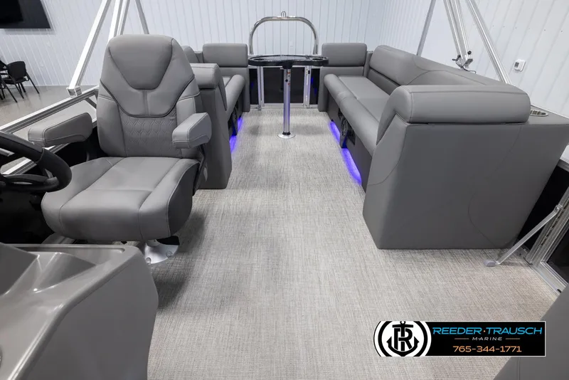 Slide: The Image of 2025 Avalon VLS QL boat interior with gray seating and ambient blue lighting. - 15