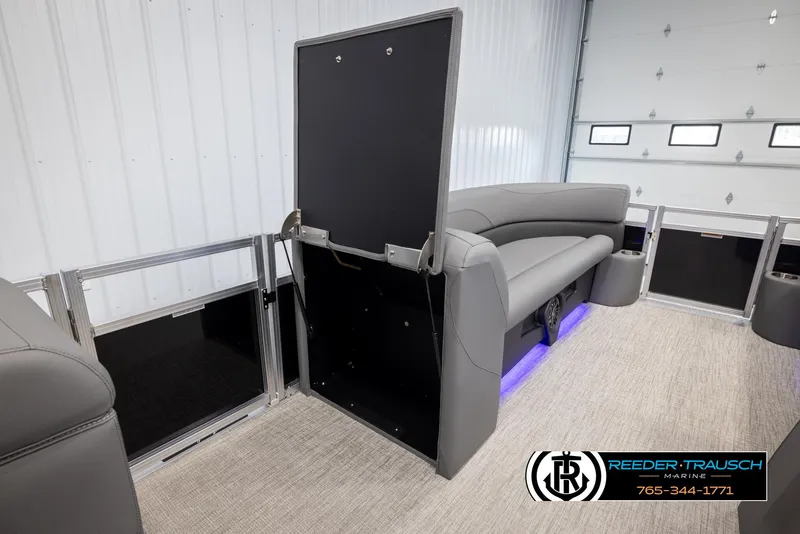 Slide: The Image of Interior of 2025 Avalon VLS QL pontoon boat with gray seating and blue LED lighting. - 22
