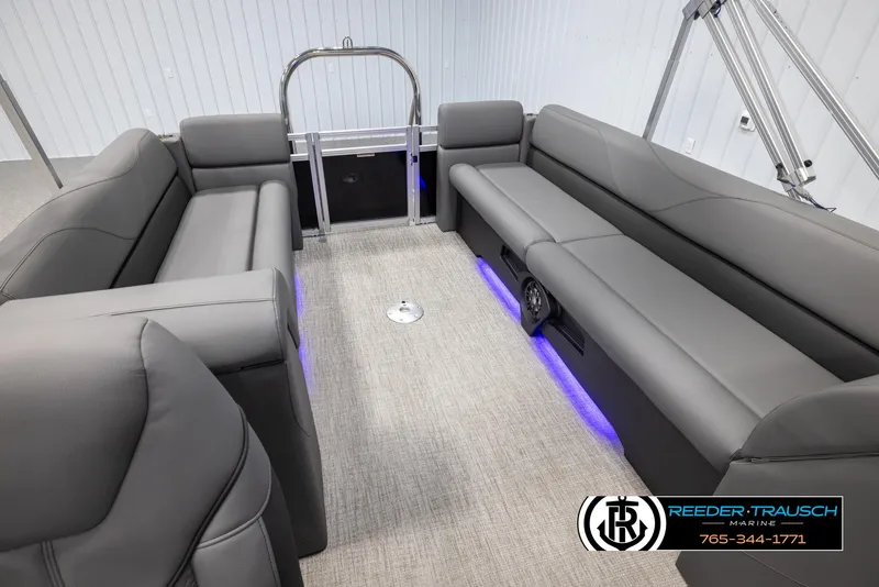 Slide: The Image of 2025 Avalon VLS QL boat interior with gray seating and blue LED lighting. - 24
