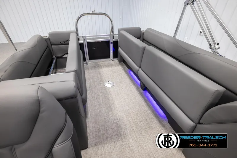 Slide: The Image of Interior of 2025 Avalon VLS QL boat with gray seating and blue LED lighting. - 25