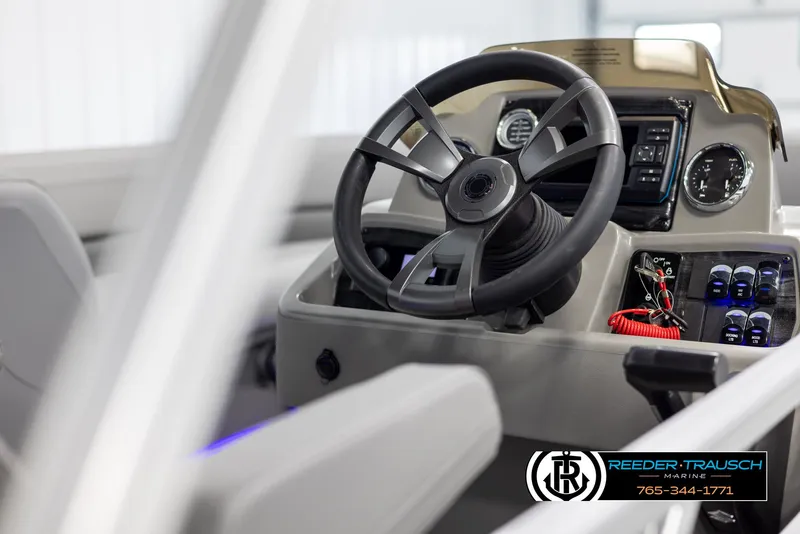 Slide: The Image of 2025 Avalon VLS QL boat steering console with modern controls and dashboard. - 26